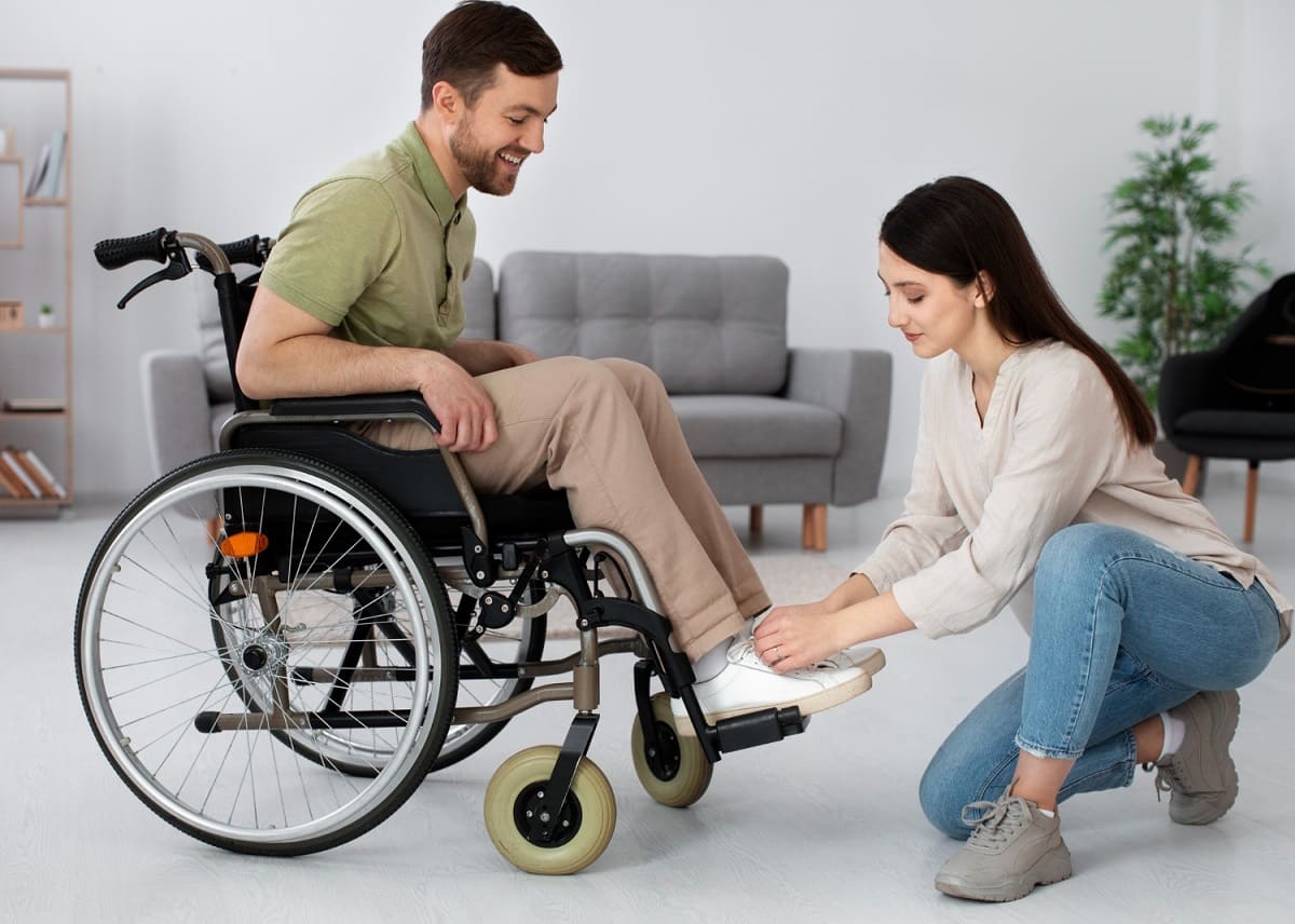 young-adult-taking-care-disabled-friend (1)